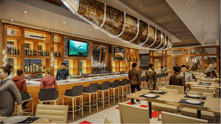 A modern restaurant interior featuring a well-lit bar area with stools, large TV screens displaying sports, and patrons mingling. Wooden accents, high ceilings, and neatly set tables create a warm atmosphere. Several people are engaged in conversation and dining.