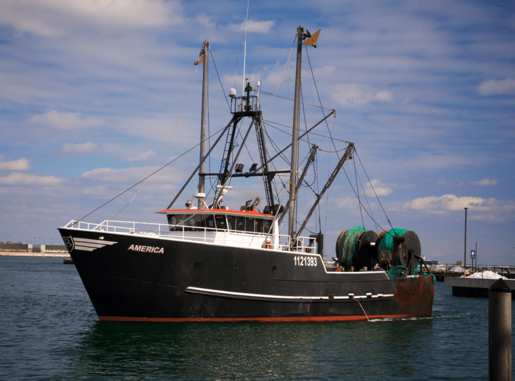 A large black fishing trawler named 